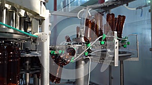 Beer. Production and bottling of beverages carbonated lemonade, soda or beer in plastic bottles on automatic conveyor on