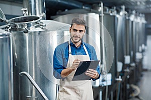 Beer production process, brewing at brewery. Plant management to make craft alcohol