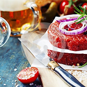 Beer and Raw Ground beef meat Burger steak cutlets with seasonin