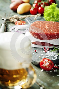 Beer and Raw Ground beef meat Burger steak cutlets with seasonin