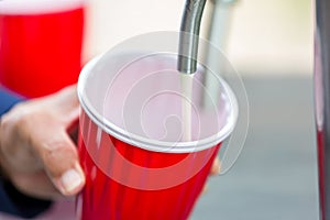 Beer in red cup. Red Plastic Drinking Cups. Plastic red solo drinking cups for beer pong or drinking game.