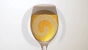 Beer's froth rising in a glass