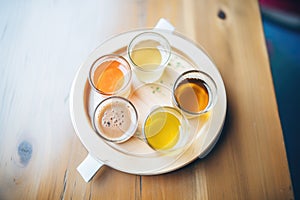 beer sampler on a circular tasting tray