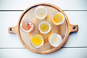 beer sampler on a circular tasting tray