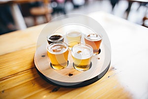 beer sampler on a circular tasting tray