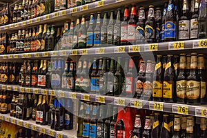 Beer on the shelves in the supermarket