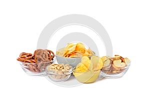 Beer snacks, potato crispy chips, nuts isolated on white background