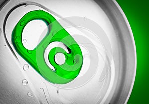 Beer or soft drink can on a green background