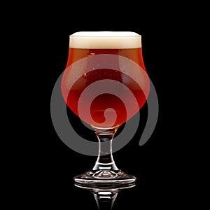 Beer in a tall glass on a dark black background. Mugs with drink like Ipa, Pale Ale, Pilsner, Porter or Stout