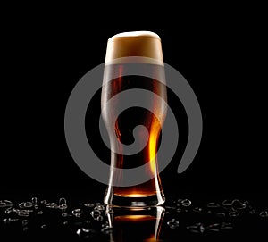 Beer in a tall glass on a dark black background. Mugs with drink like Ipa, Pale Ale, Pilsner, Porter or Stout