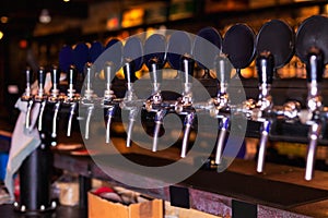 Beer tap row in bar counter