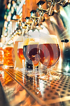 Beer taps in a pub photo