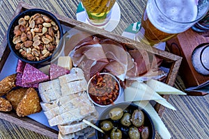 Beer tray with snacks, top view