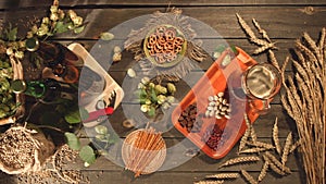 Beer and a variety of snacks on the table. Slow motion. Top view. Close-up. The smooth glide of the camera from left to right