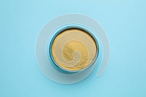 Beer yeast powder on light blue background, top view
