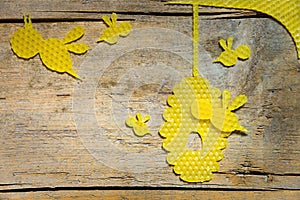 Beeswax, bees and a beehive on wooden table, copyspace