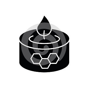Beeswax candle black glyph icon