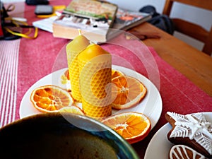 Beeswax candles and dried oranges