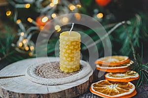 Beeswax spruce shaped candles on dark background