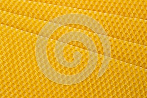 Beeswax. Wax base for honey bee rebuilding. Honeycomb. Natural honeycomb bee background.