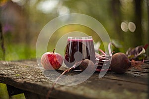 Beet-apple juice in glass on table