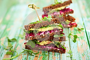 Beet,avocado and arugula sandwich