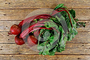 Beet, beetroot bunch wooden background