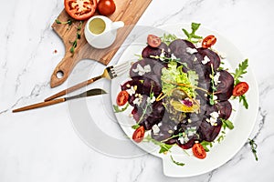 Beet carpaccio with feta, arugula and olive oil. banner, menu, recipe place for text, top view