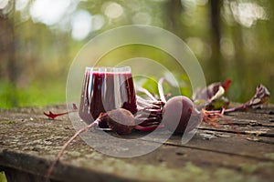 Beet juice in glass on table