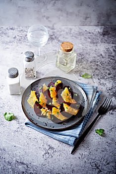 Beet orange cilantro salad with spicy olive oil vinegar sauce in a plate