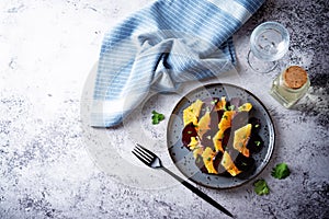 Beet orange cilantro salad with spicy olive oil vinegar sauce in a plate