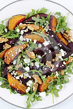 Beet salad with arugula, cheese and nuts