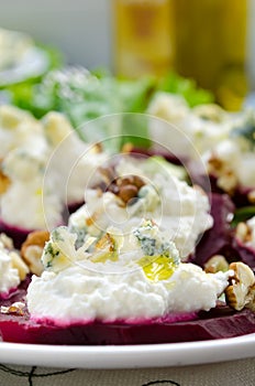 Beet Salad with goat cheese, walnuts, greens and herbs