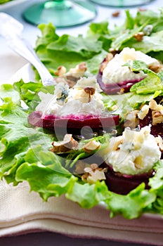 Beet Salad with goat cheese, walnuts, greens and herbs