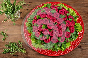 Beet salad with pancakes in the shape of a bouquet of roses