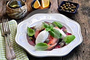 Beet salad, soft cheese and smoked salmon with capers and olive oil.