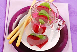 Beet soup with cream and grissini photo