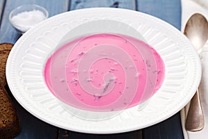 Beet soup on white plate