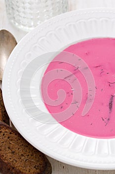 Beet soup on white plate