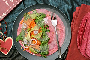 Beet tortilla wraps filled with veggies as a healthy lunch