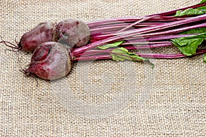 Beetroot on hessian on rustic wooden table