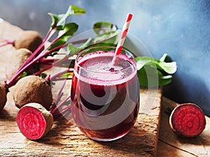 Beetroot juice in glass and fresh organics beetroot.