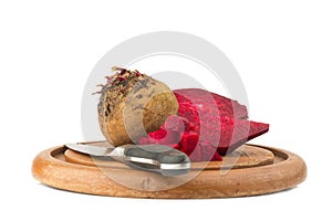 beetroot with knife on chopping board isolated on white background