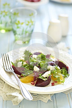 Beetroot and orange salad with goat cheese and pomegranate