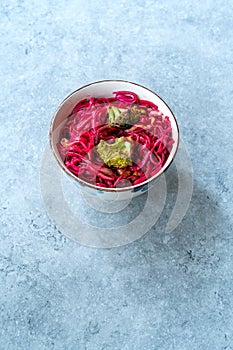 Beetroot Pad Thai Rice Noodles with Beet Flavored and Broccoli in Bowl