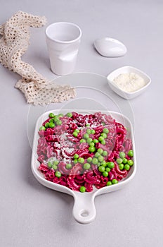 Beetroot pasta with green peas