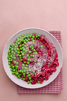 Beetroot pasta with green peas