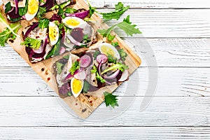 Beetroot and Pickled Marinated Herring Open Sandwich on Rye Bread