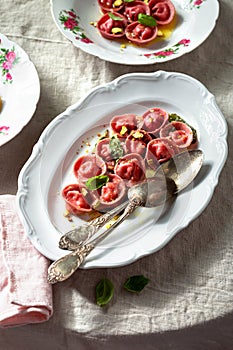 Beetroot ravioli with goat cheese, mozzarella, parmesan, butter sauce