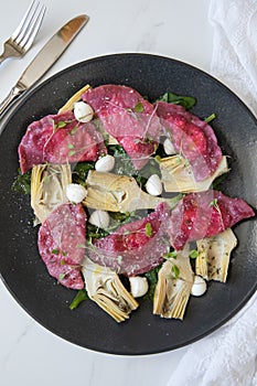 Beetroot Ravioli/Pelmeni filled with Ricotta-Goat cheese, sauteed Artichokes hearts in a sage butter sauce